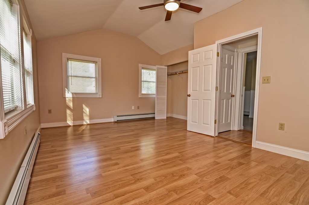 87-89 Pleasant Street Needham, MA 02492 - Photo 27 of 30 an empty room with wooden floor and windows