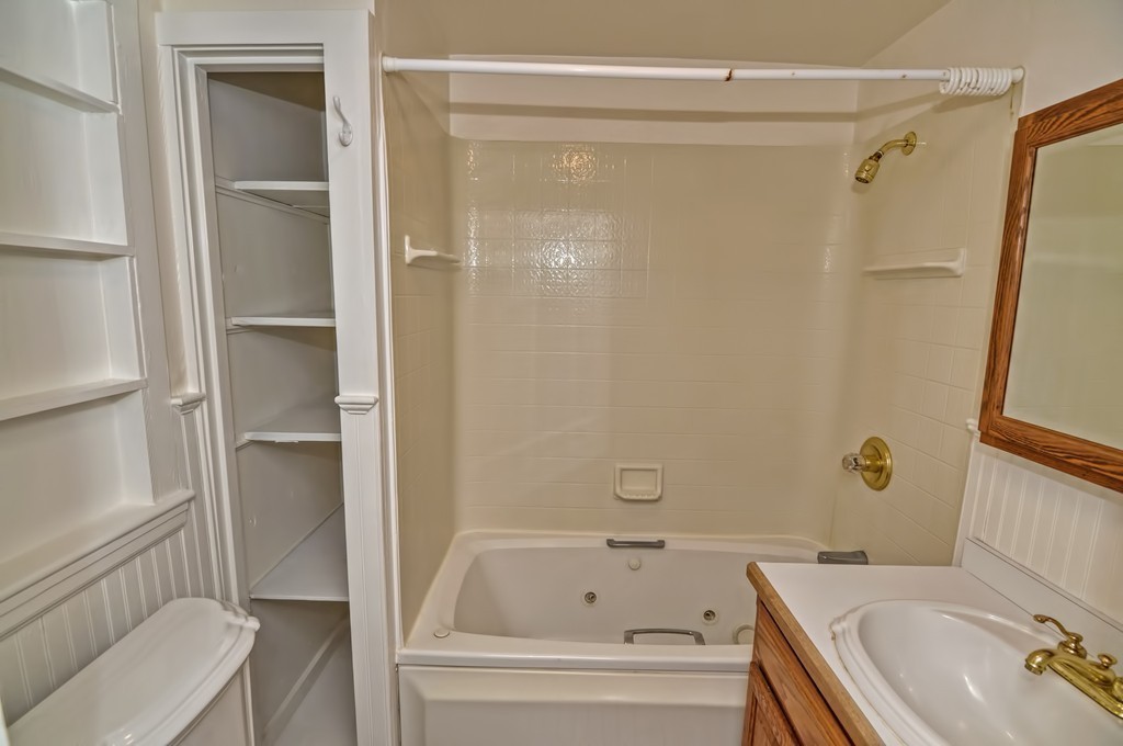 87-89 Pleasant Street Needham, MA 02492 - Photo 29 of 30 a bathroom with a tub and a sink