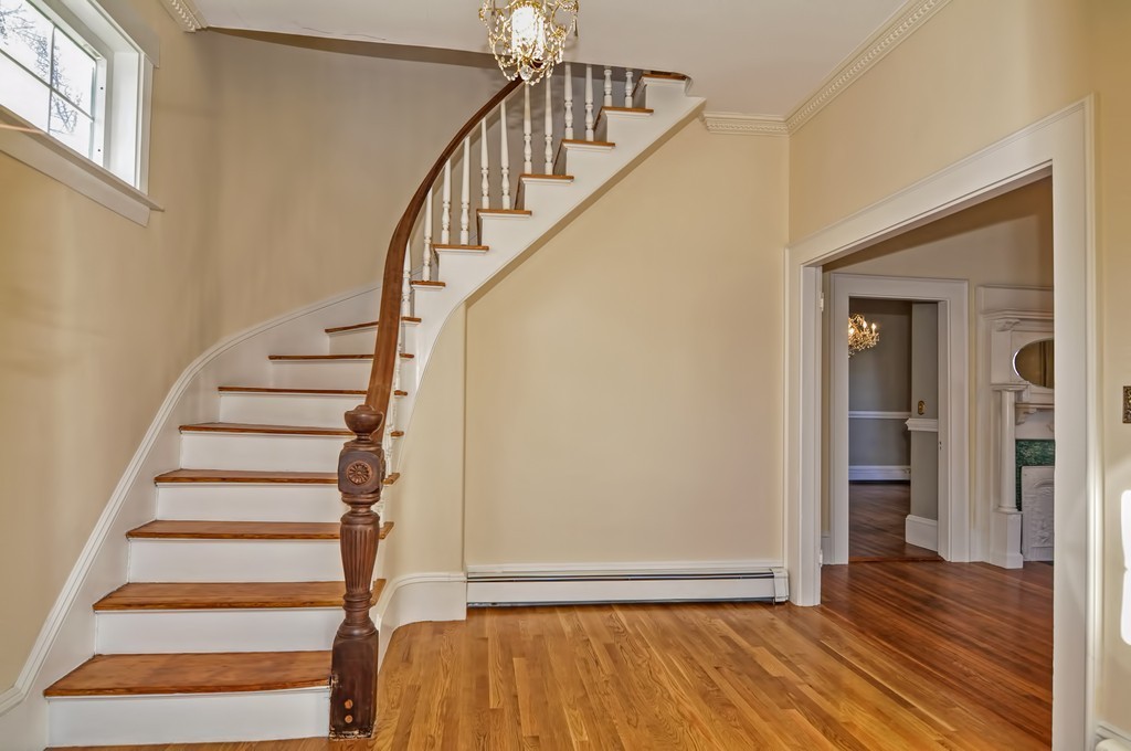87-89 Pleasant Street Needham, MA 02492 - Photo 3 of 30 a view of entryway with wooden floor and stairs