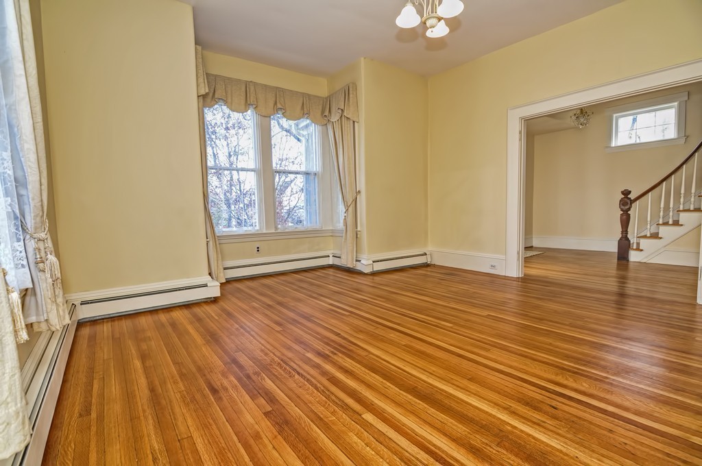 87-89 Pleasant Street Needham, MA 02492 - Photo 5 of 30 an empty room with wooden floor and windows