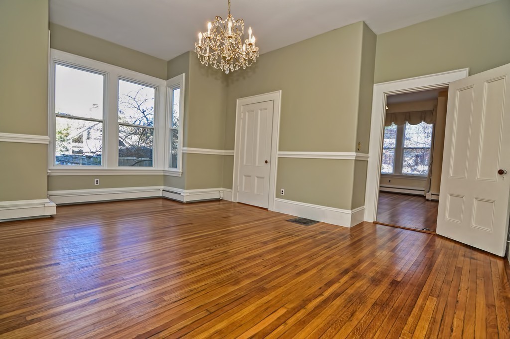87-89 Pleasant Street Needham, MA 02492 - Photo 7 of 30 wooden floor in an empty room with a window