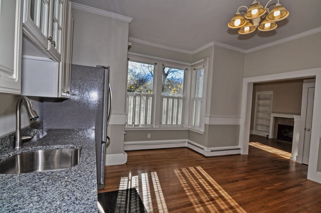 87-89 Pleasant Street Needham, MA 02492 - Photo 9 of 30 a bathroom with a sink a vanity and a window