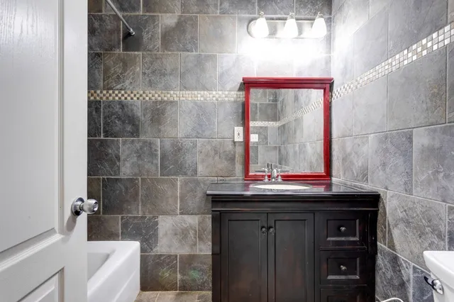 a bathroom with a bathtub and a shower