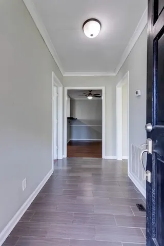 a kitchen with granite countertop white cabinets white appliances and a sink