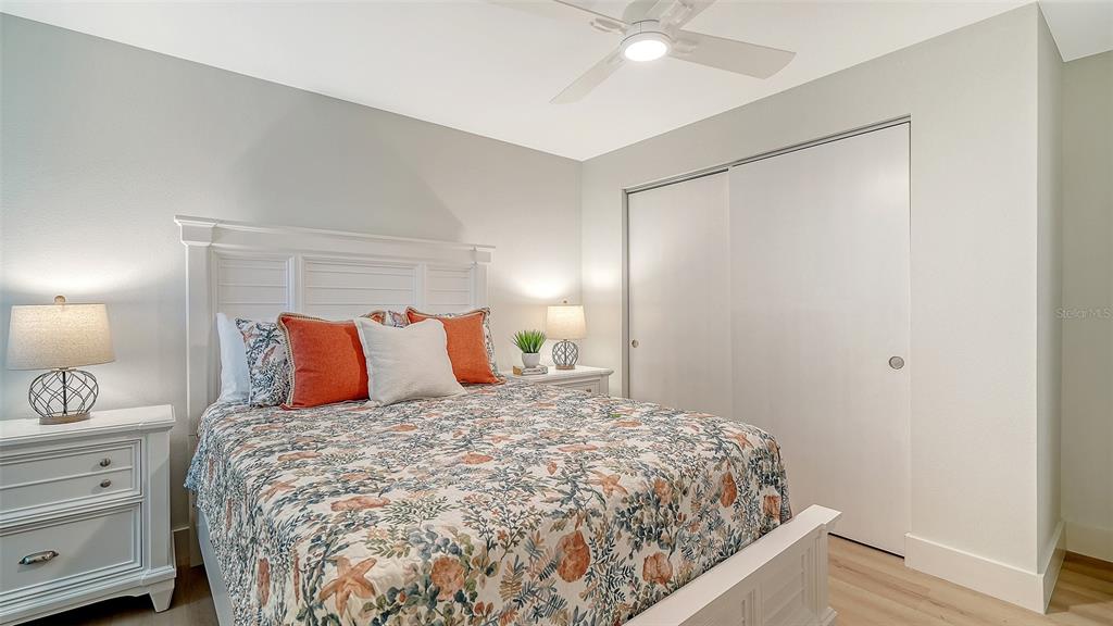 5950 Midnight Pass Road, Unit 201 Sarasota, FL 34242 - Photo 14 of 36 a large bed in a white room