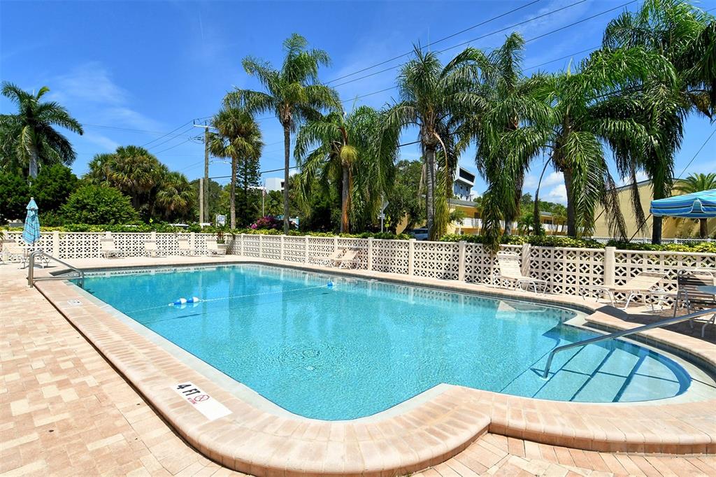5950 Midnight Pass Road, Unit 201 Sarasota, FL 34242 - Photo 28 of 36 a view of swimming pool with a lounge chair