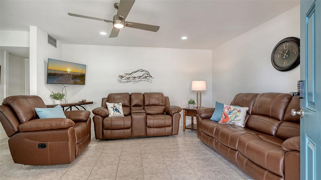 5950 Midnight Pass Road, Unit 201 Sarasota, FL 34242 - Photo 3 of 36 a living room with furniture