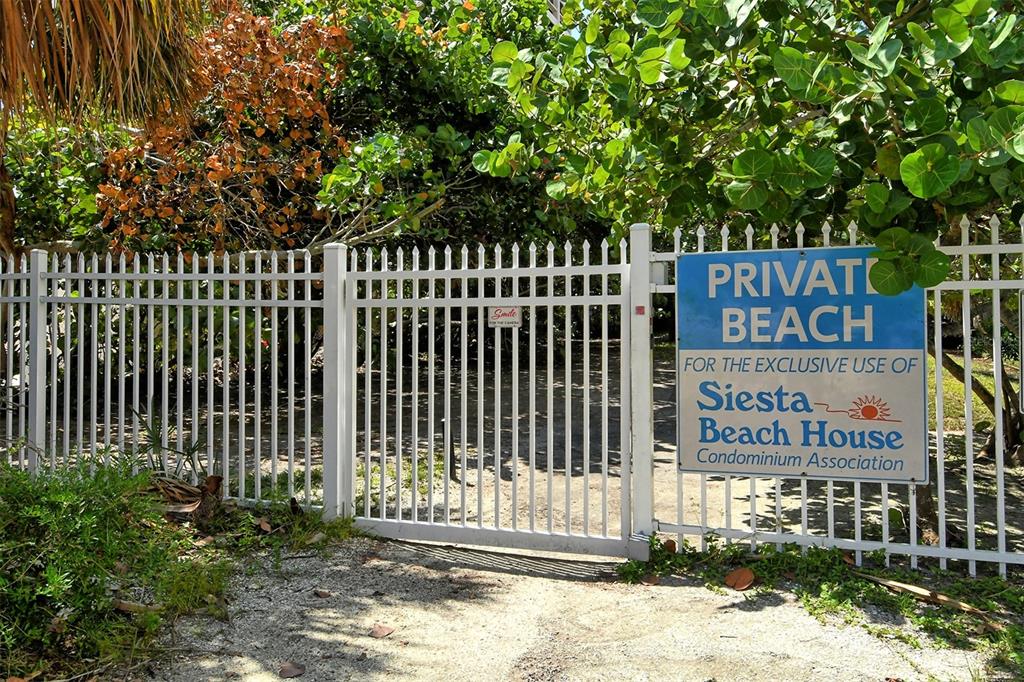 5950 Midnight Pass Road, Unit 201 Sarasota, FL 34242 - Photo 32 of 36 a sign on the side of a building