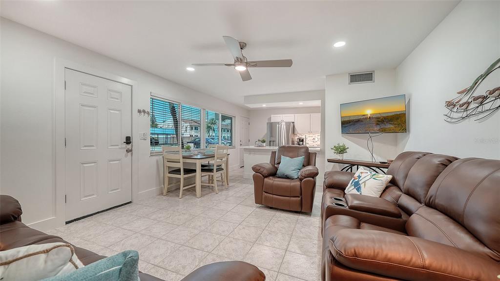 5950 Midnight Pass Road, Unit 201 Sarasota, FL 34242 - Photo 6 of 36 a living room with furniture and a large window