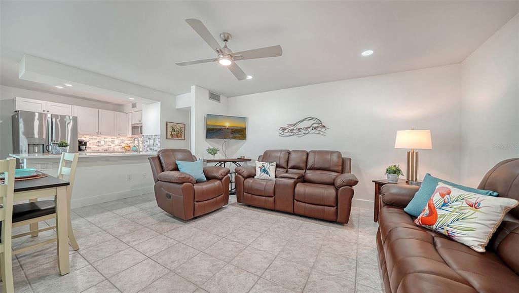5950 Midnight Pass Road, Unit 201 Sarasota, FL 34242 - Photo 7 of 36 a living room with furniture and kitchen view