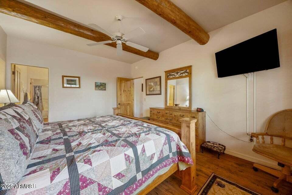 2522 Village Loop Pinetop, AZ 85935 - Photo 14 of 38 a bedroom with a bed and a flat screen tv