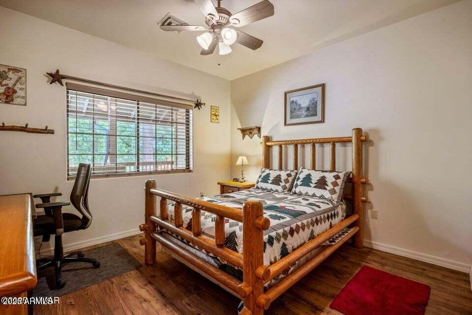 2522 Village Loop Pinetop, AZ 85935 - Photo 18 of 38 a bed sitting in a bedroom next to a window