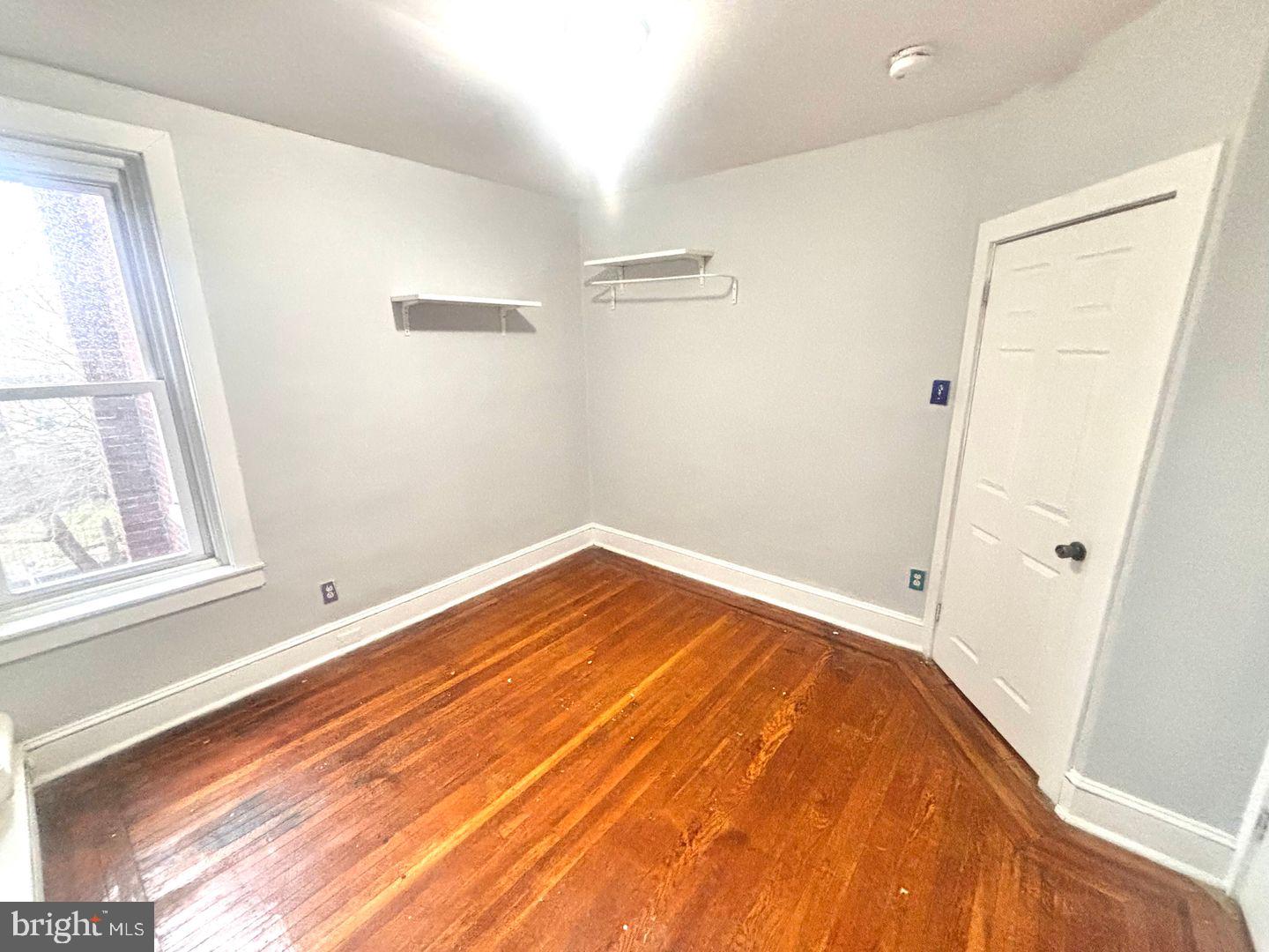 1736 North 59th Street Philadelphia, PA 19151 - Photo 12 of 19 a view of empty room with wooden floor and fan
