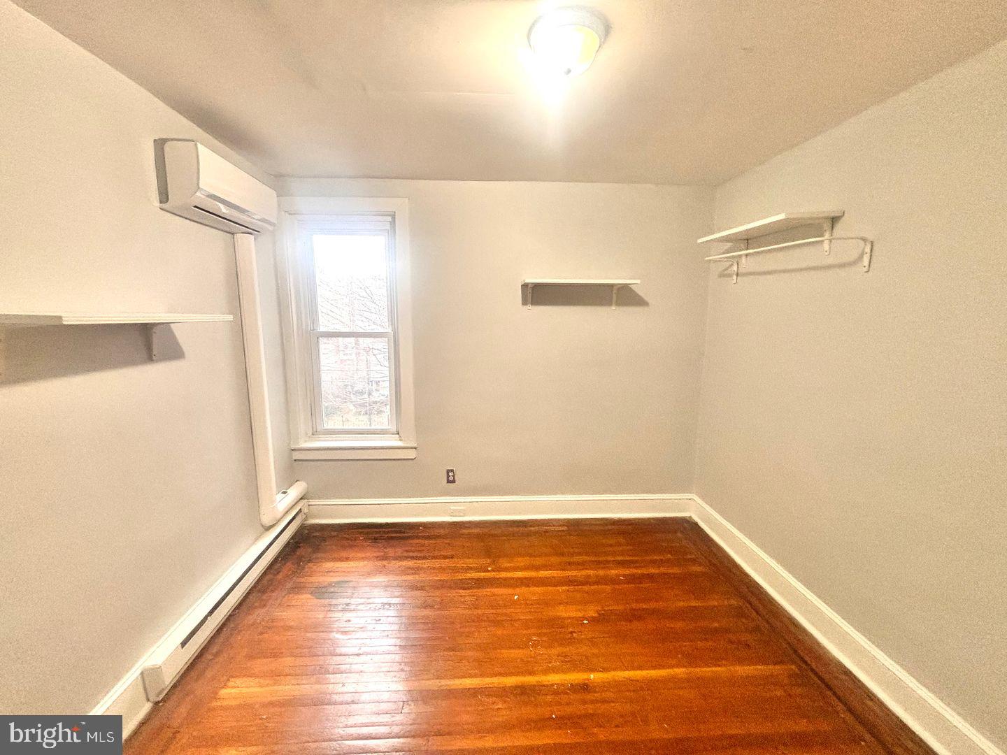 1736 North 59th Street Philadelphia, PA 19151 - Photo 13 of 19 a view of a room with wooden floor and a window