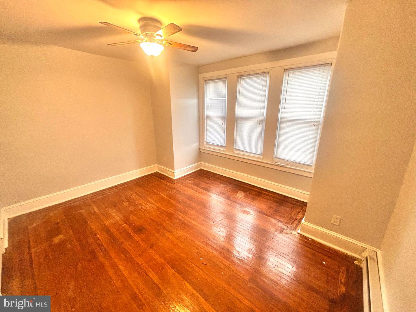 1736 North 59th Street Philadelphia, PA 19151 - Photo 17 of 19 a view of empty room with wooden floor and fan