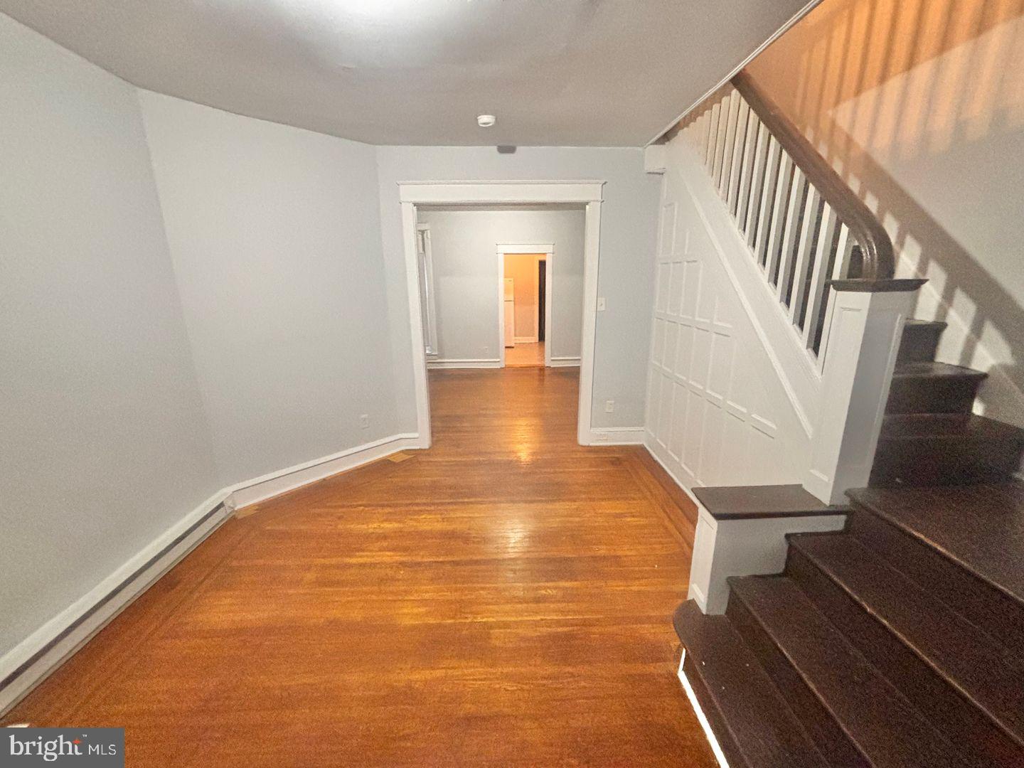 1736 North 59th Street Philadelphia, PA 19151 - Photo 19 of 19 a view of an empty room with wooden floor