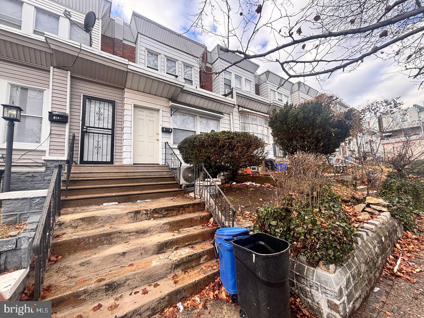 1736 North 59th Street Philadelphia, PA 19151 - Photo 2 of 19 a front view of a house with a yard