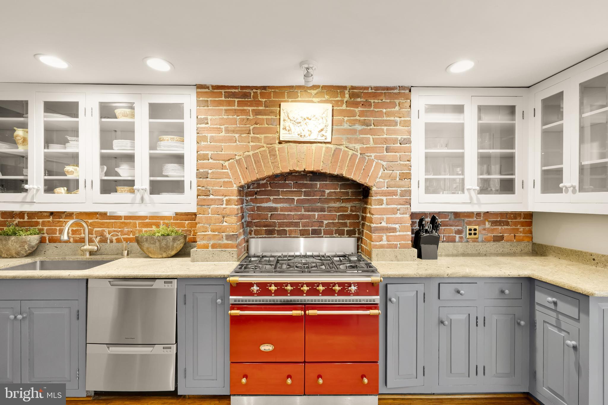 107 5th Street Southeast Washington, DC 20003 - Photo 11 of 26 a kitchen with granite countertop a stove and a sink