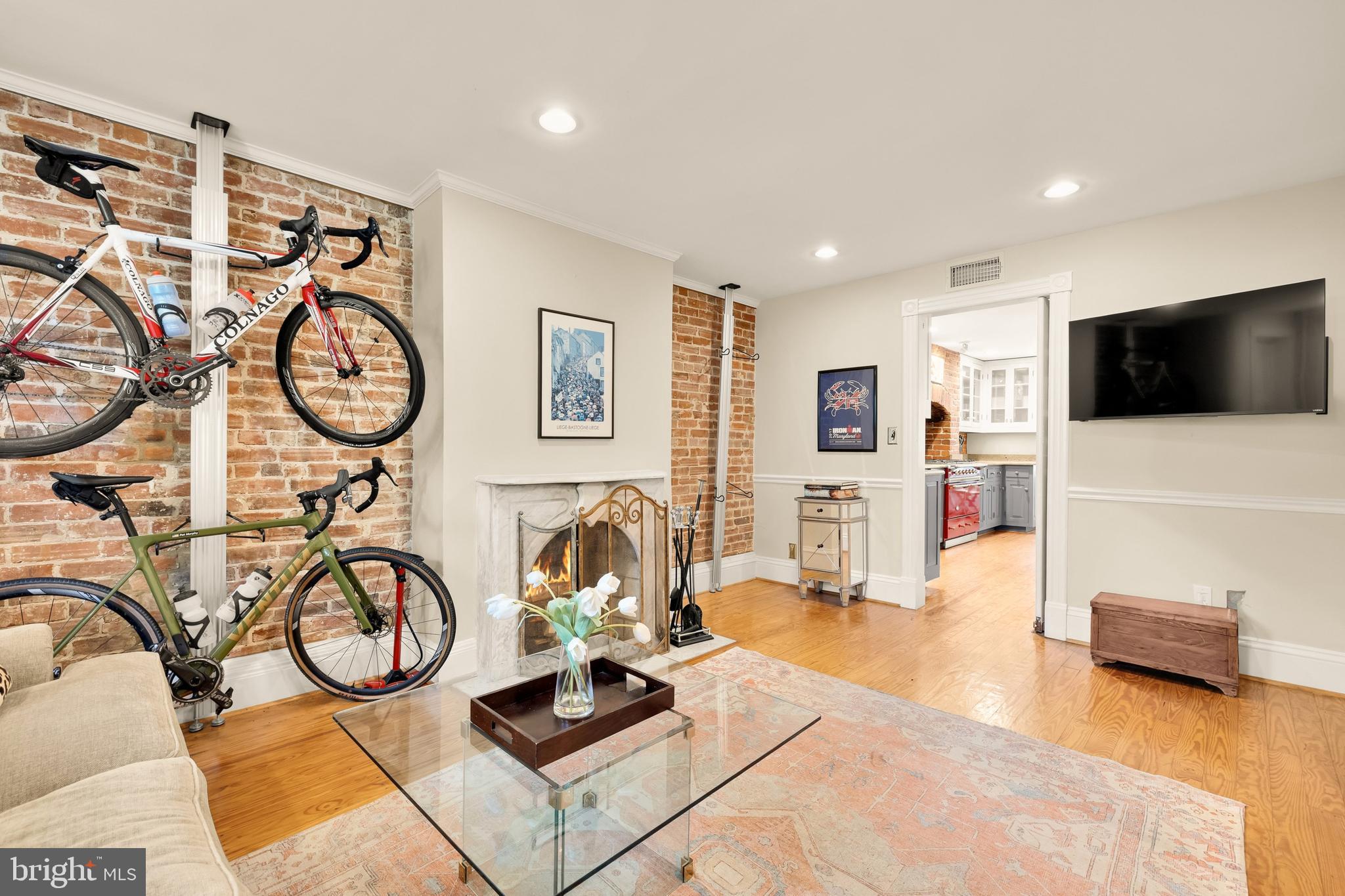 107 5th Street Southeast Washington, DC 20003 - Photo 14 of 26 a living room with furniture a flat screen tv and a large window