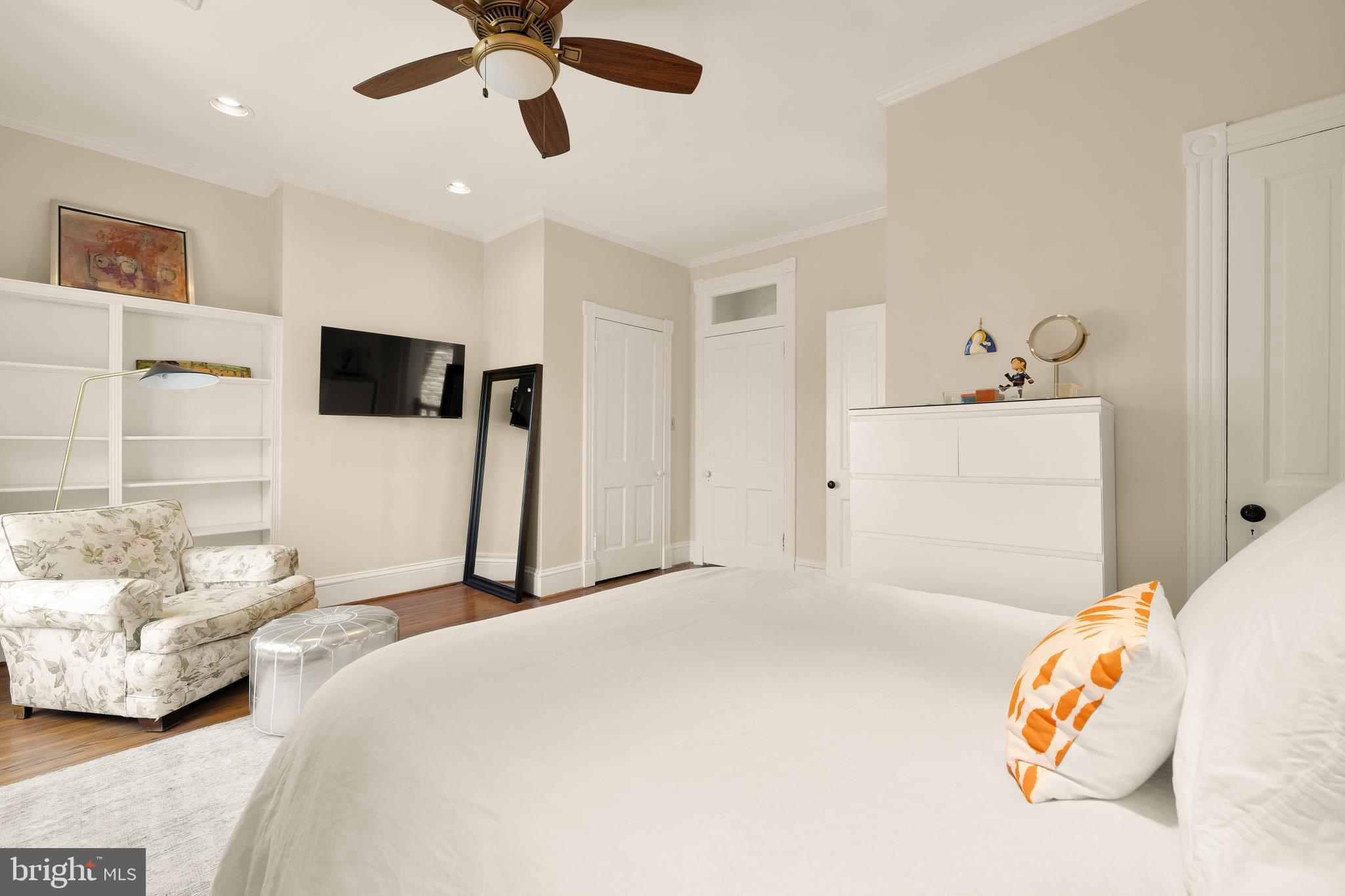 107 5th Street Southeast Washington, DC 20003 - Photo 23 of 26 a bedroom with a bed and a flat screen tv