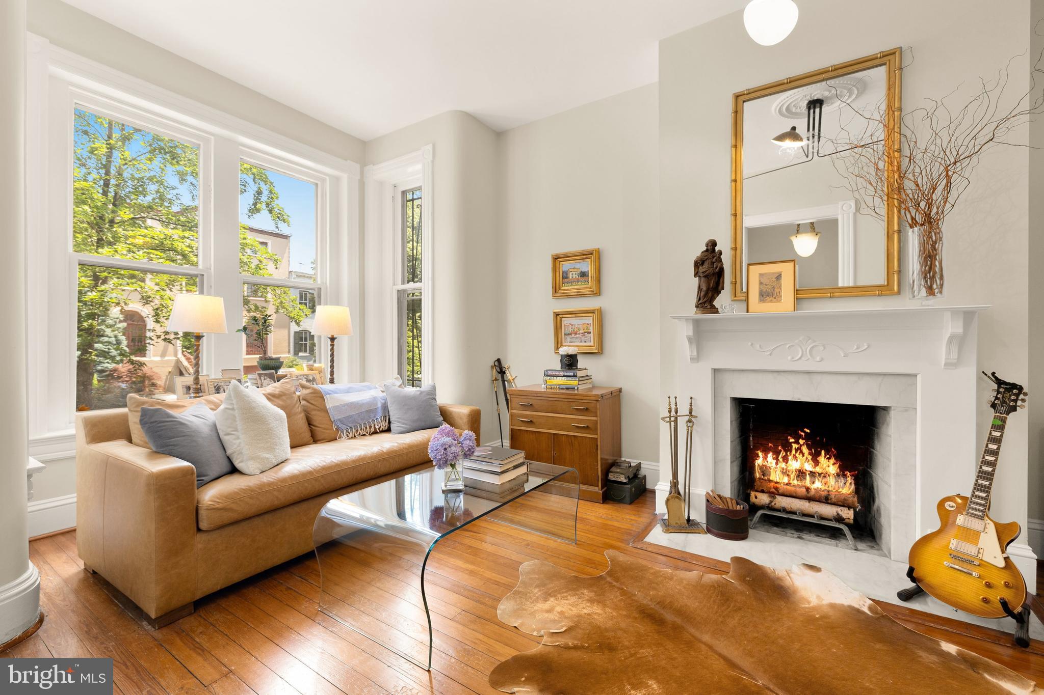 107 5th Street Southeast Washington, DC 20003 - Photo 4 of 26 a living room with furniture and a fireplace