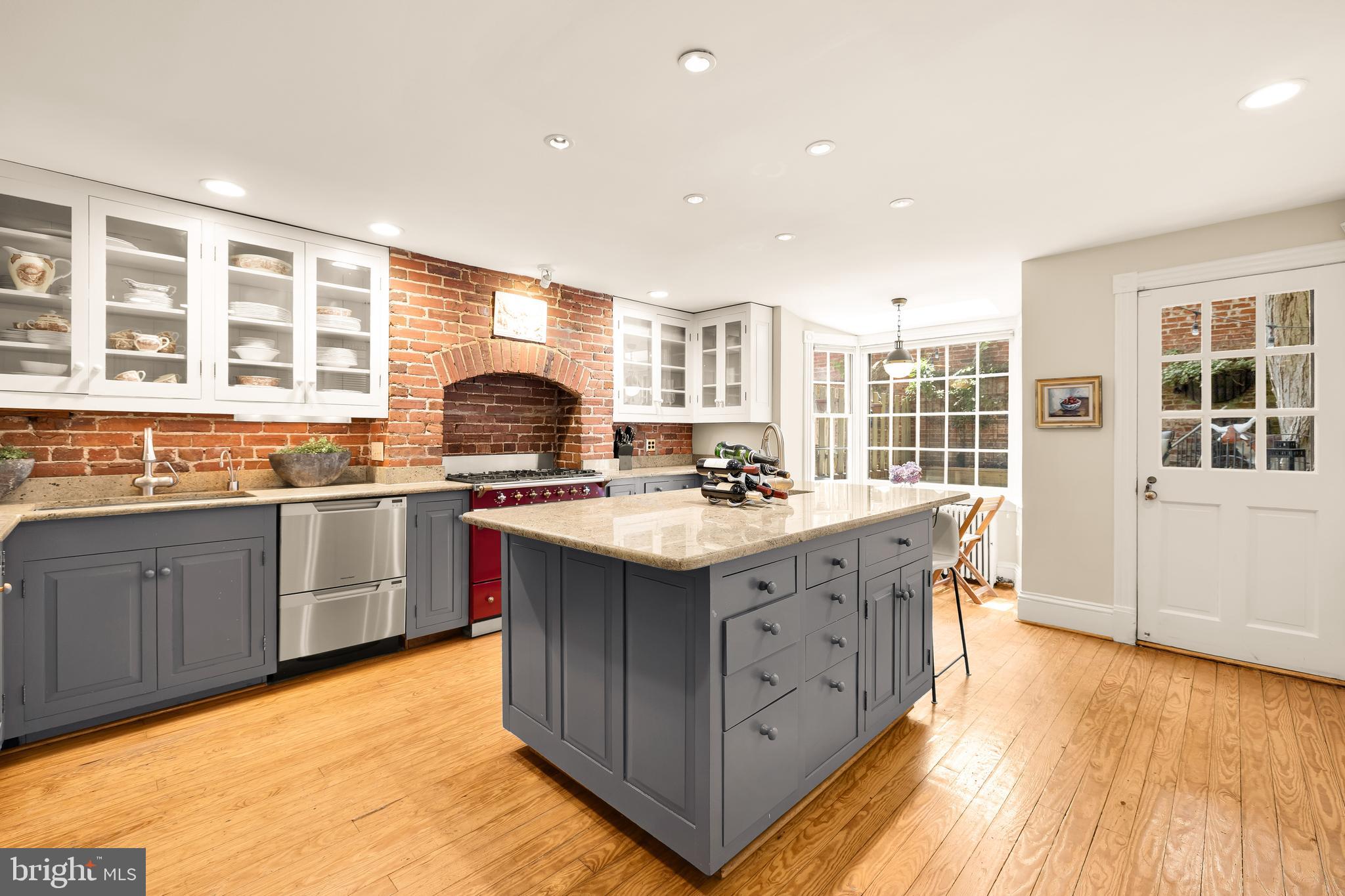 107 5th Street Southeast Washington, DC 20003 - Photo 9 of 26 a kitchen with stainless steel appliances granite countertop a stove and a sink