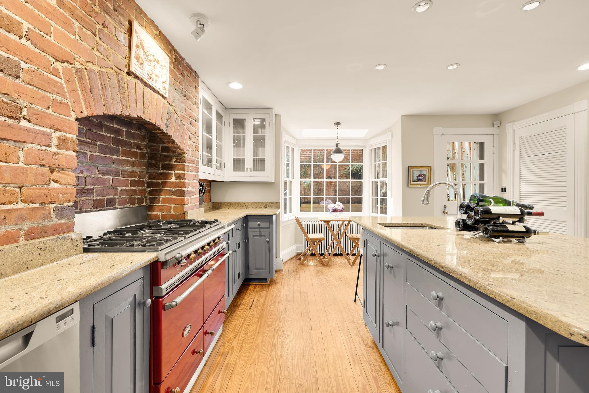 107 5th Street Southeast Washington, DC 20003 - Photo 10 of 26 a kitchen with stainless steel appliances granite countertop a stove and a sink