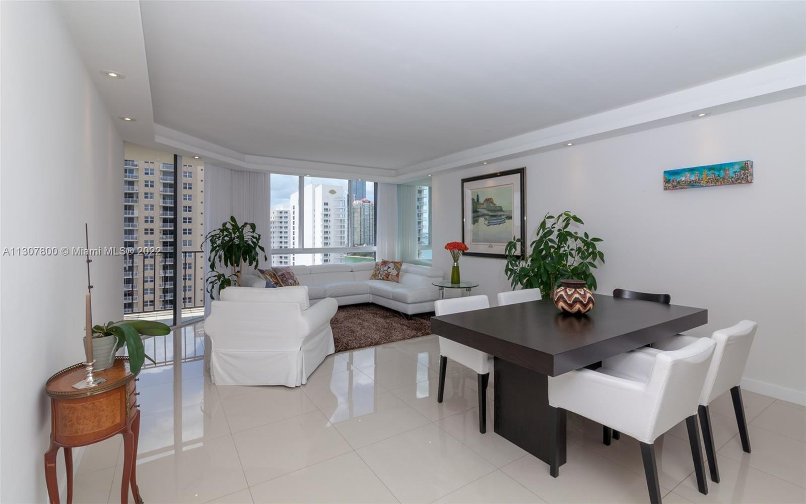 520 Brickell Key Drive, Unit A1603 Miami, FL 33131 - Photo 1 of 27 a view of a dining room with furniture and window