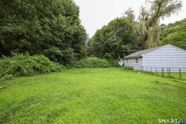 a view of a backyard with a small cabin