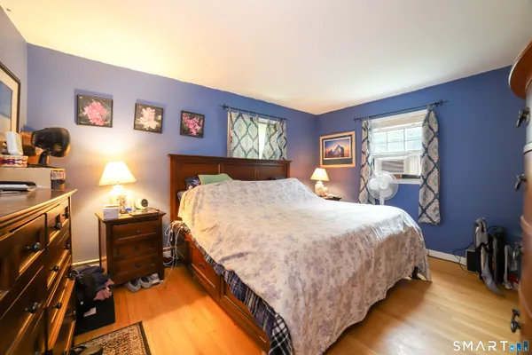 a bedroom with a bed and furniture