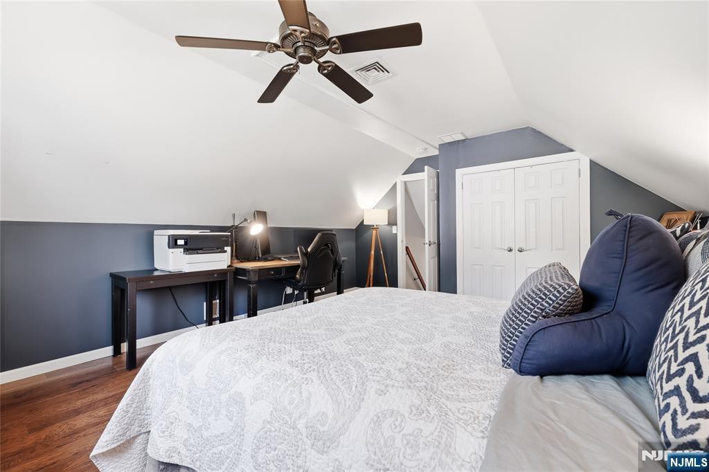 77 White Pond Road Waldwick, NJ 07463 - Photo 22 of 33 a bedroom with a bed and wooden floor