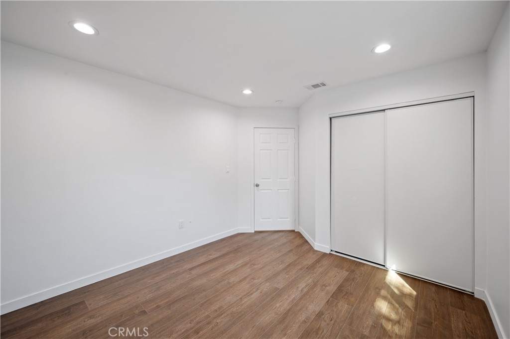 7445 Balcom Avenue Reseda, CA 91335 - Photo 13 of 73 a view of a room with wooden floor