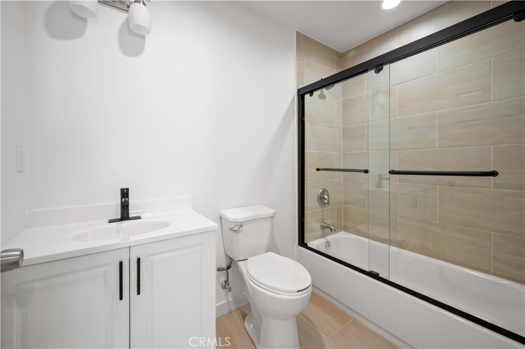 7445 Balcom Avenue Reseda, CA 91335 - Photo 17 of 73 a bathroom with a sink a toilet and shower