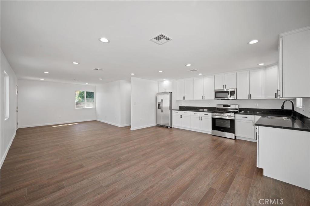 7445 Balcom Avenue Reseda, CA 91335 - Photo 19 of 73 a view of kitchen with kitchen island sink and stainless steel appliances