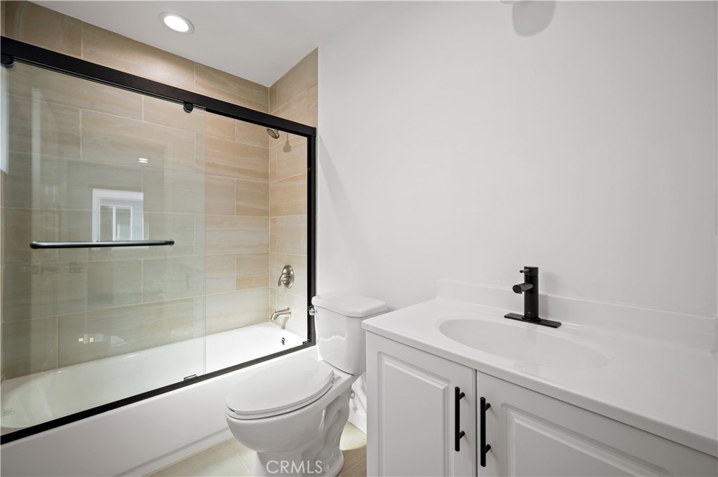 7445 Balcom Avenue Reseda, CA 91335 - Photo 23 of 73 a bathroom with a sink a toilet and shower