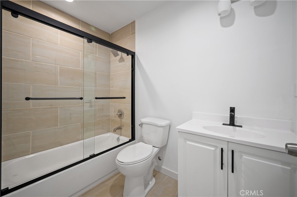 7445 Balcom Avenue Reseda, CA 91335 - Photo 24 of 73 a bathroom with a shower a toilet and a sink