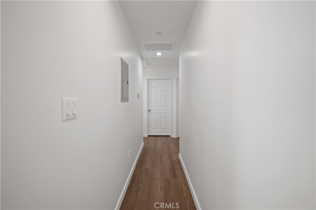 7445 Balcom Avenue Reseda, CA 91335 - Photo 26 of 73 a view of a hallway with wooden floor