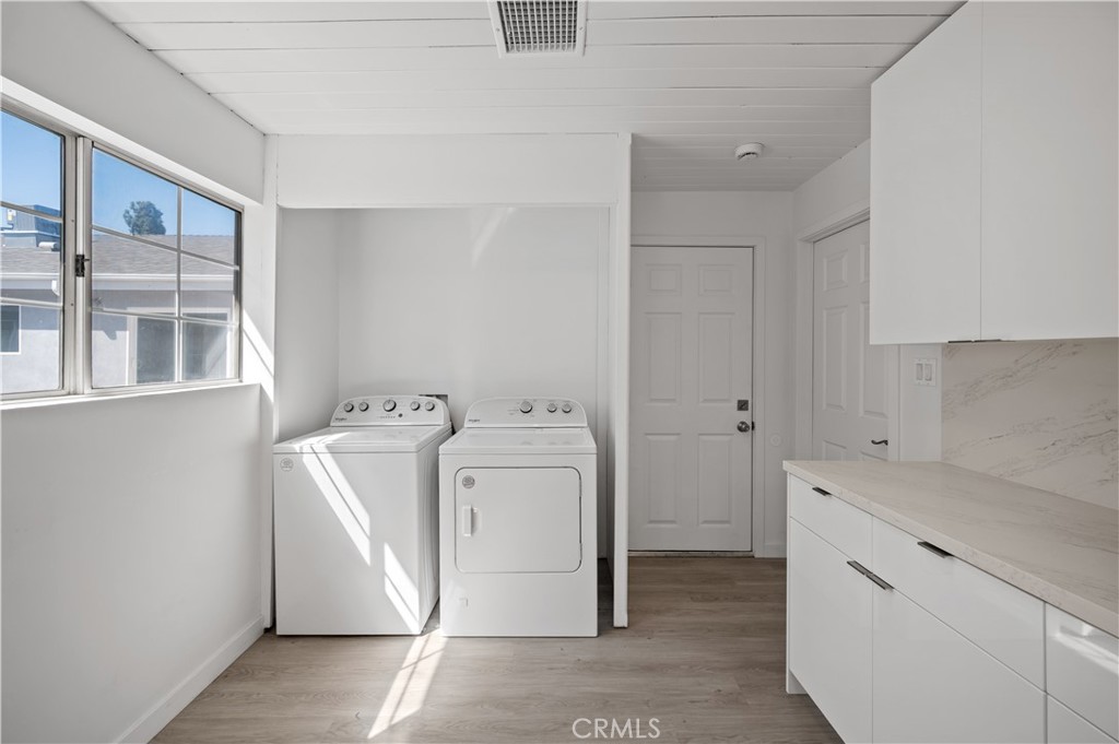 7445 Balcom Avenue Reseda, CA 91335 - Photo 36 of 73 a utility room with dryer and washer