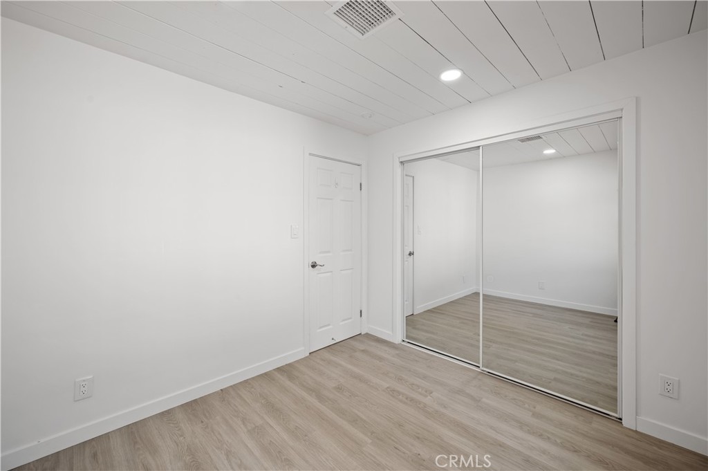 7445 Balcom Avenue Reseda, CA 91335 - Photo 39 of 73 a view of an empty room with wooden floor
