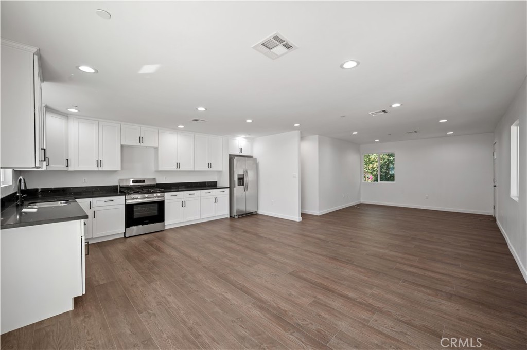 7445 Balcom Avenue Reseda, CA 91335 - Photo 42 of 73 a view of kitchen with wooden floor and electronic appliances
