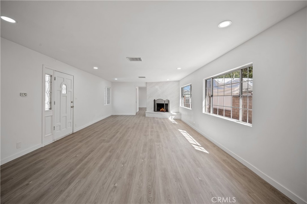 7445 Balcom Avenue Reseda, CA 91335 - Photo 44 of 73 a view of a big room with wooden floor and windows