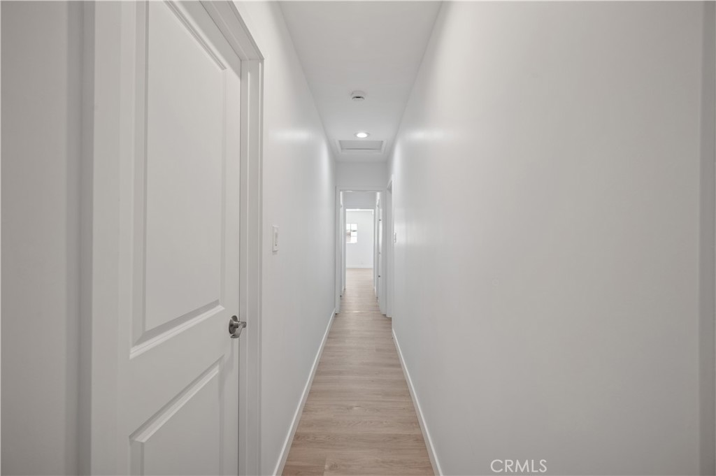 7445 Balcom Avenue Reseda, CA 91335 - Photo 57 of 73 a view of a hallway with wooden floor