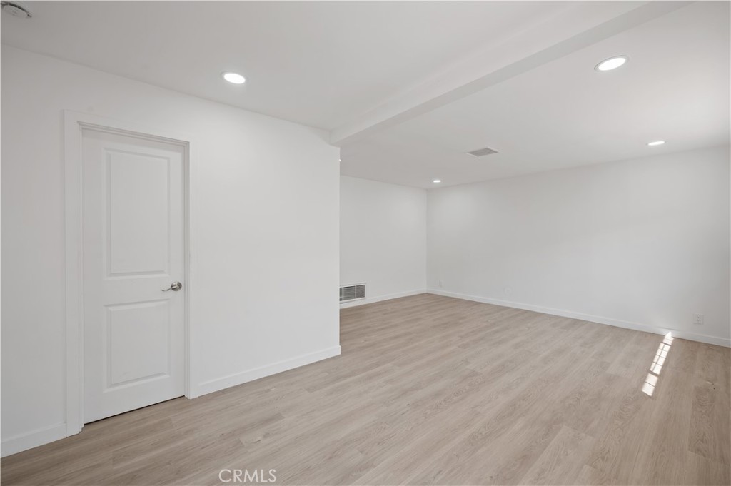7445 Balcom Avenue Reseda, CA 91335 - Photo 59 of 73 a view of an empty room with wooden floor and closet