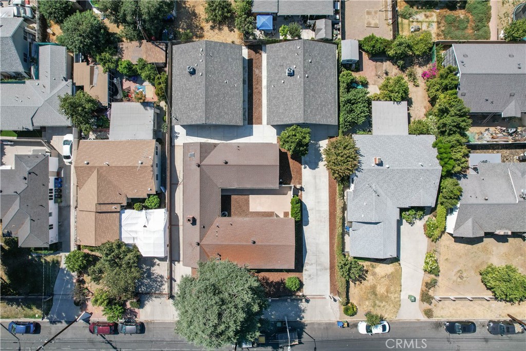 7445 Balcom Avenue Reseda, CA 91335 - Photo 69 of 73 an aerial view of multiple houses with outdoor space
