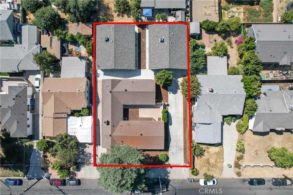 7445 Balcom Avenue Reseda, CA 91335 - Photo 70 of 73 an aerial view of multiple houses with outdoor space and parking