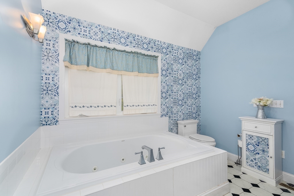 113 Greenwich Plains Road Ware, MA 01082 - Photo 20 of 42 a bathroom with a bathtub and a shower