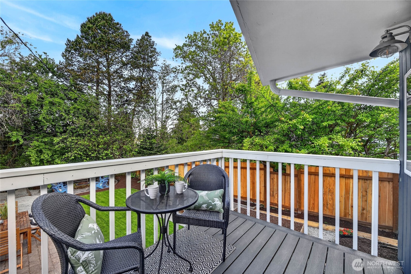 3245 45th Avenue Southwest Seattle, WA 98116 - Photo 11 of 31 a view of a chair in wooden deck