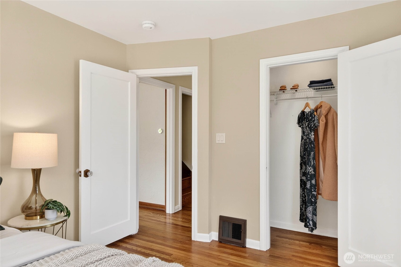 3245 45th Avenue Southwest Seattle, WA 98116 - Photo 14 of 31 a view of a bedroom with wooden floor table and closet