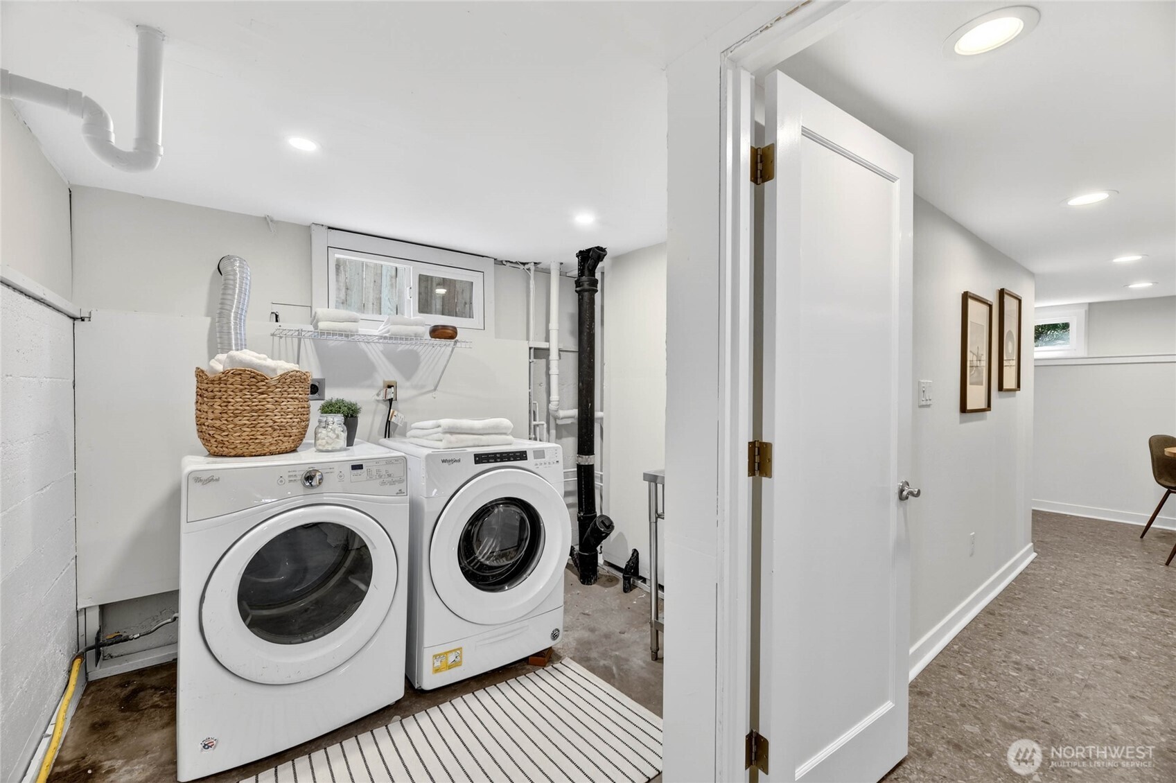 3245 45th Avenue Southwest Seattle, WA 98116 - Photo 24 of 31 a view of a hallway with washer and dryer