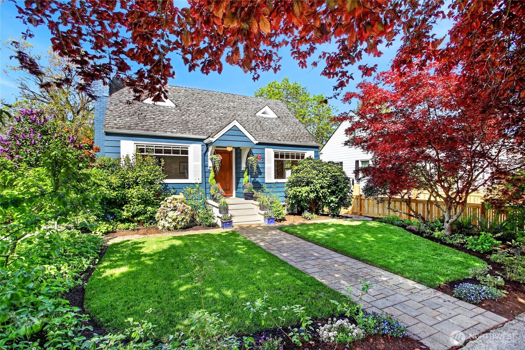3245 45th Avenue Southwest Seattle, WA 98116 - Photo 27 of 31 a front view of a house with a yard